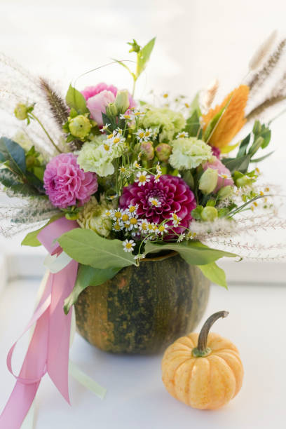 istock Bright fall autumn bouquet in pumpkin 1344915142