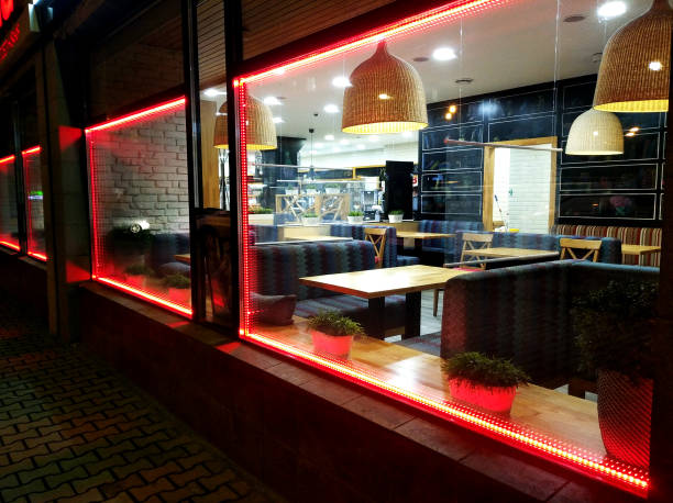 istock Cafe interior through window from the street side 1344916101