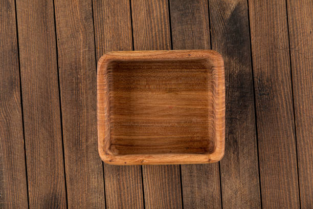 istock Square brown empty natural wooden bowl 1344917510