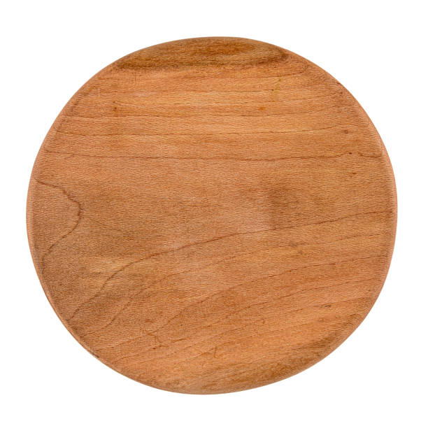 Isolated round wooden cutting board on white