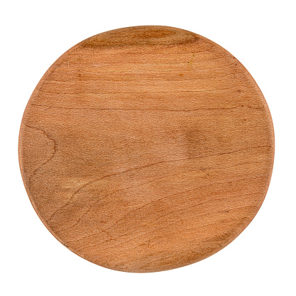 Isolated round wooden cutting board on a white background
