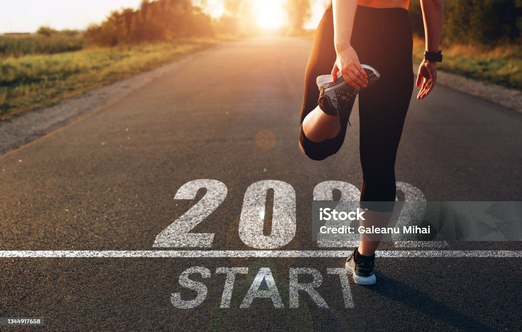 Sports girl who wants to start the new year 2022. Concept of new professional achievements in the new year and success Sports girl who wants to start the new year 2022. Concept of new professional achievements in the new year and success. 2022 Stock Photo