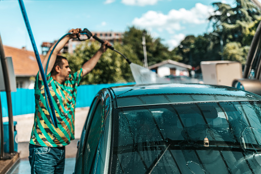 Car washing. Cleaning Car Using High Pressure Water.