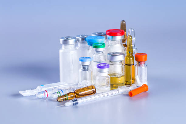 istock Coronavirus COVID-19 medical test vaccine research and development concept. Pharmacy theme, capsule pills with medicine antibiotic in packages. 1344920743