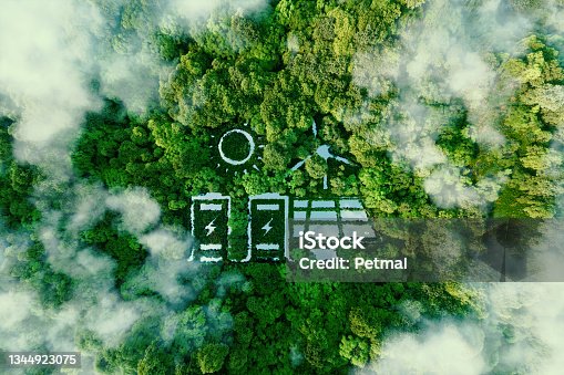 istock A lake in the shape of a solar, wind and energy storage system in the middle of a lush forest as a metaphor for the concept of clean and organic renewable energy. 3d rendering. 1344923075