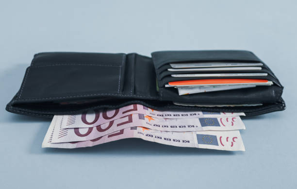 istock Black wallet and 500 euro bills on gray 1344924296