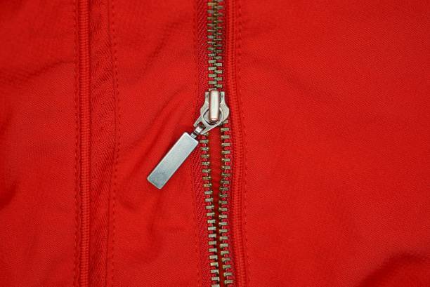 istock one gray metal open zip on a red fabric 1344924714