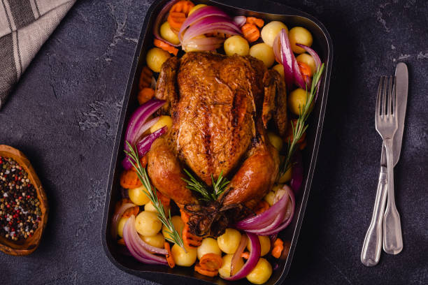 istock Whole baked chicken with vegetables 1344925982