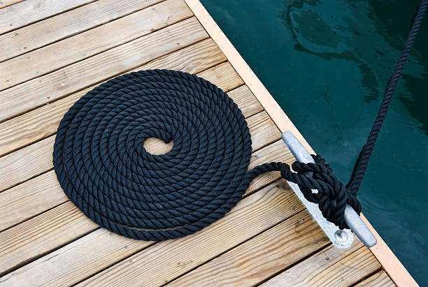 rope of yacht Black yacht's rope on dock. moored photos stock pictures, royalty-free photos & images