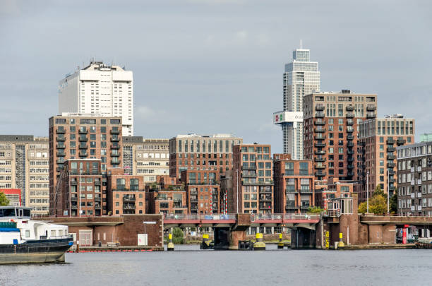 Rotterdam, The Netherlands, October 3, 2021: Coolhaven harbour with a bridge and the recently completed Little C residential project