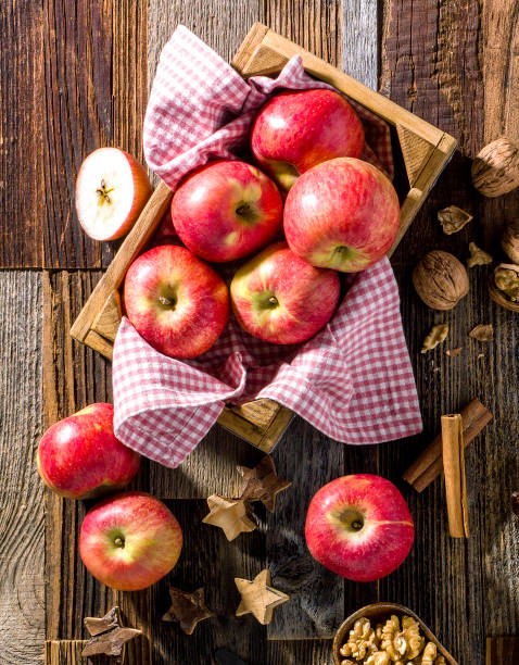 Fresh red apples in wooden box stock photo