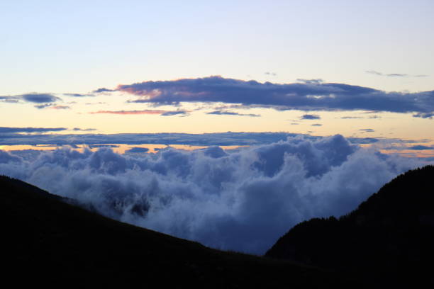 istock sunrise in the high mountains above the clouds 1344927423