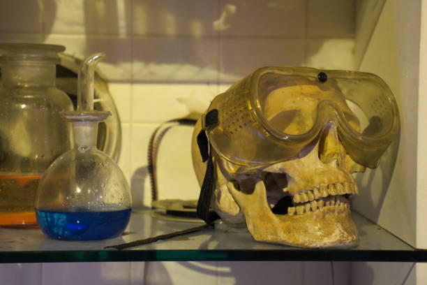 istock chemistry lab, skull with mask and magic potions 1344927606
