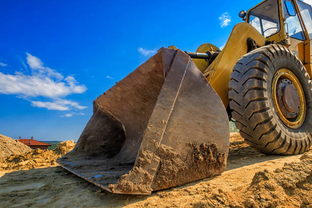 cubo grande - earth mover digging land bulldozer fotografías e imágenes de stock