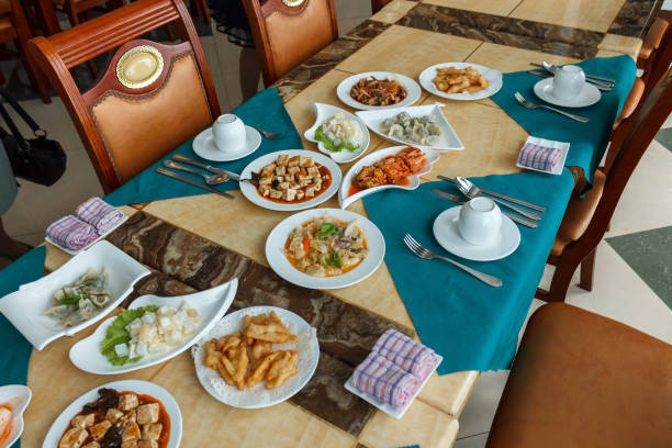 A table with snacks is served for tourists. Restaurant in Pyongyang. North Korea