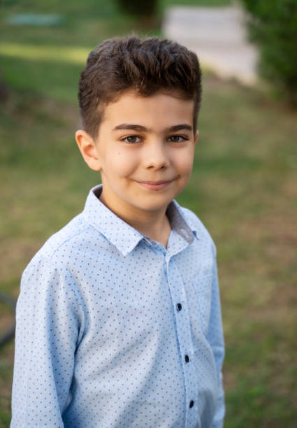 istock Cute little boy portrait at park 1344930315