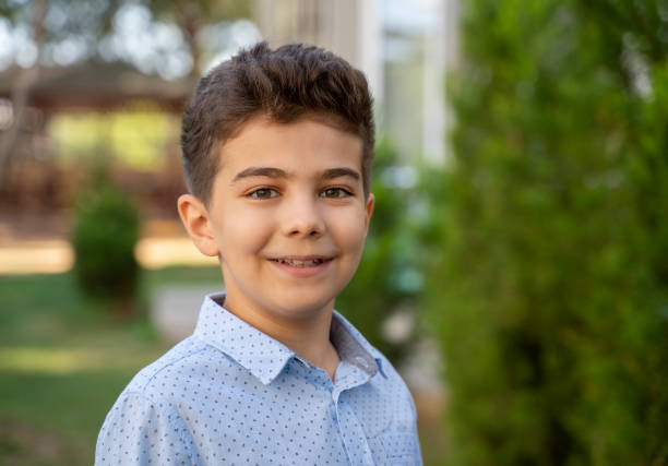 istock Cute little boy portrait at park 1344930341