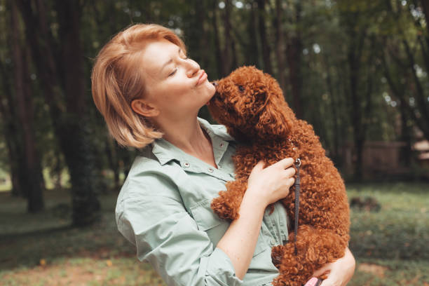 istock Young Woman With Dog 1344931419