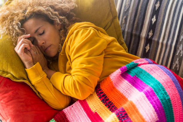 istock Woman Sleeping On Sofa At Home 1344933893