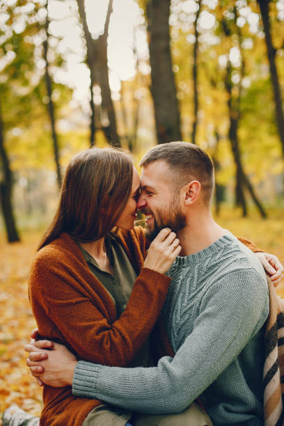 istock Beautiful couple spend time in a autumn park 1344936871