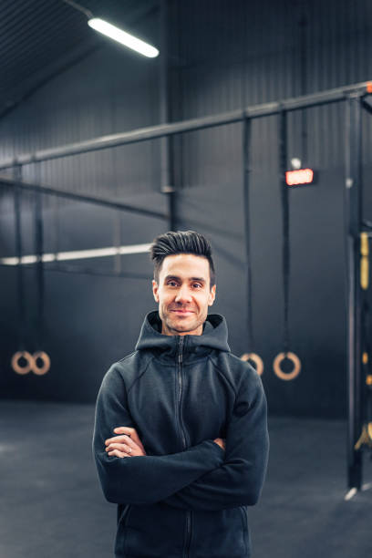 istock Male athlete with arms crossed in gym 1344937321