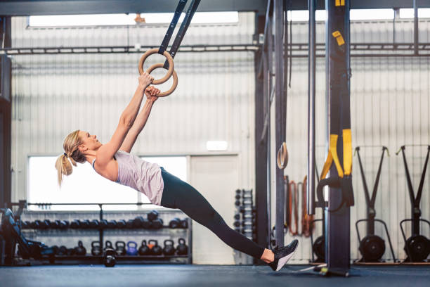 istock Female athlete exercising with gymnastic ring 1344938424