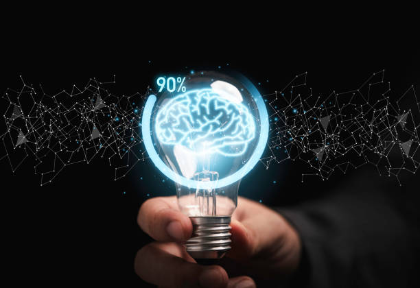istock Businessman holding lightbulb with virtual brain and downloading icon progress for creative thinking solution and smart problem solving concept. 1344939669