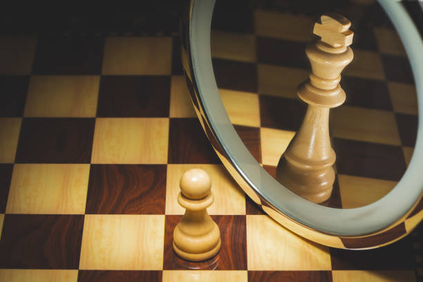 istock Pawn who sees himself king in the mirror 1344939710