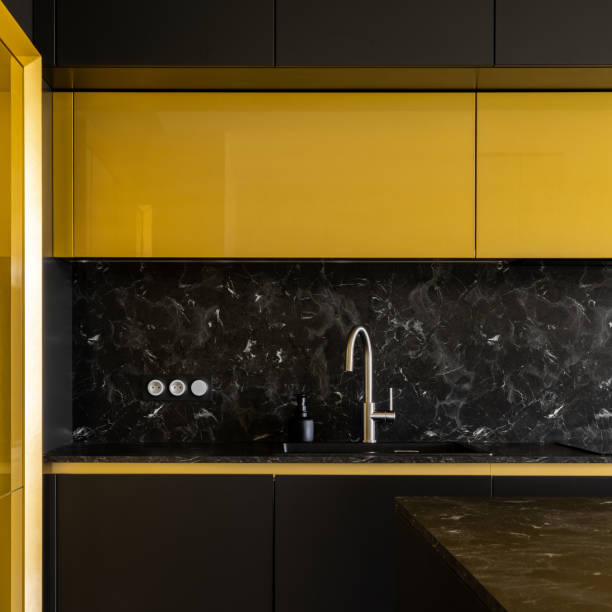 istock Stylish kitchen in black and gold, close-up 1344941694