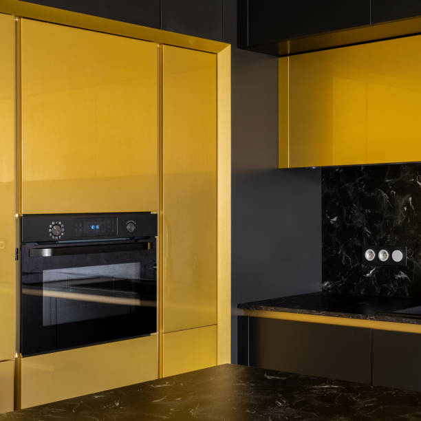 istock Oven in fancy kitchen in gold and black, close-up 1344941704