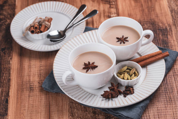 istock Indian masala chai tea. Spiced tea with milk on the rustic wooden table. 1344943604