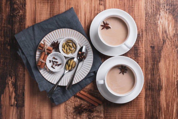 istock Indian masala chai tea. Spiced tea with milk on the rustic wooden table. 1344943667
