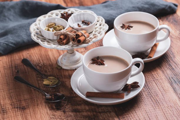 istock Indian masala chai tea. Spiced tea with milk on the rustic wooden table. 1344943696