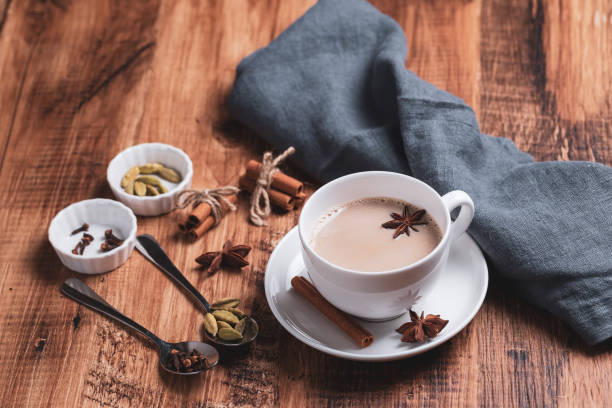 istock Indian masala chai tea. Spiced tea with milk on the rustic wooden table. 1344943714