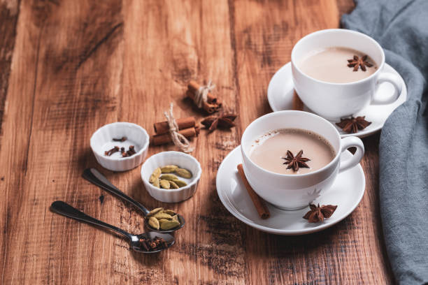 istock Indian masala chai tea. Spiced tea with milk on the rustic wooden table. 1344943736