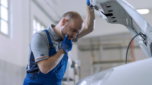 istock Professional mechanic doing a car inspection 1344945060