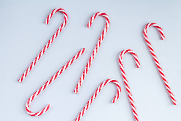 istock Traditional christmas candy cane background top view 1344945424