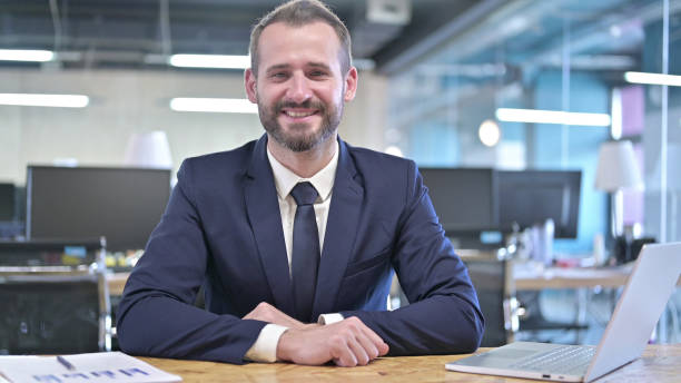 istock Cheerful Young Businessman Smiling and looking at Camera 1344945676