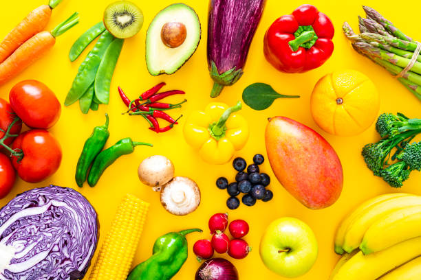 Fruits and vegetables on yellow background