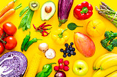 Fruits and vegetables on yellow background