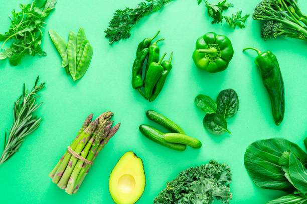 istock Green vegetables on green background 1344947185