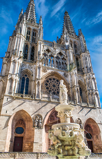 Fountain and main façade Gothic cathedral of Burgos seen from the Plaza de Santa María, Spain