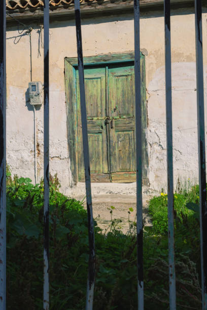 istock Railings in front of a weathered door 1344949354