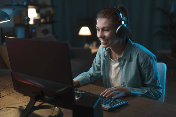 istock Girl playing online video games 1344949519
