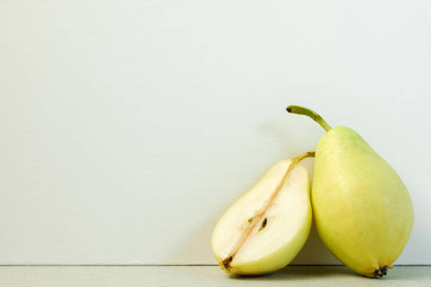 istock ripe full pear and half of pear 1344951253