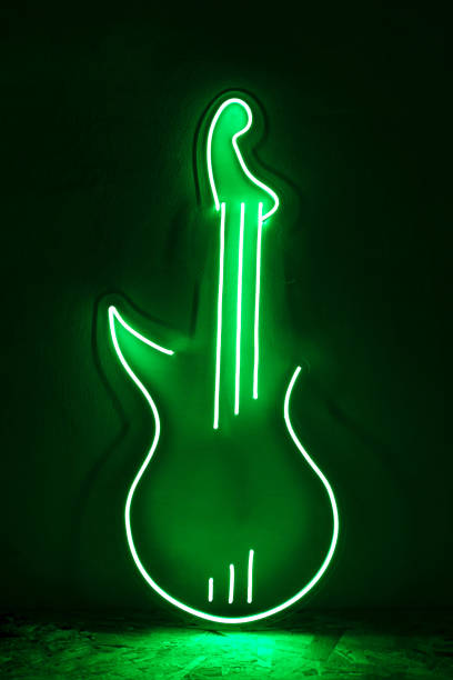 Guitar, beautiful guitar wrapped in lines of lights, selective focus.