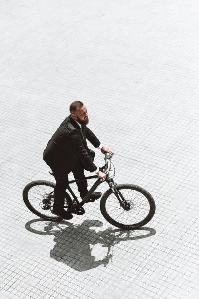 istock Modern Businessman Going To Work By Bicycle 1344952390