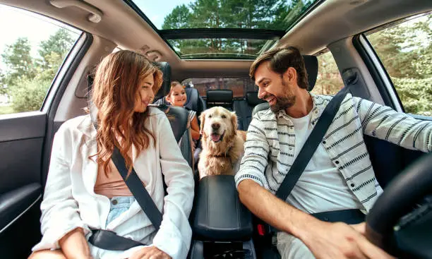 Photo of Family with dog in the car