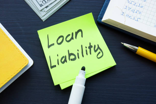 istock Loan liability memo and cash on the desk. 1344955970