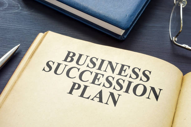 istock Open business succession plan on the wooden surface. 1344956533